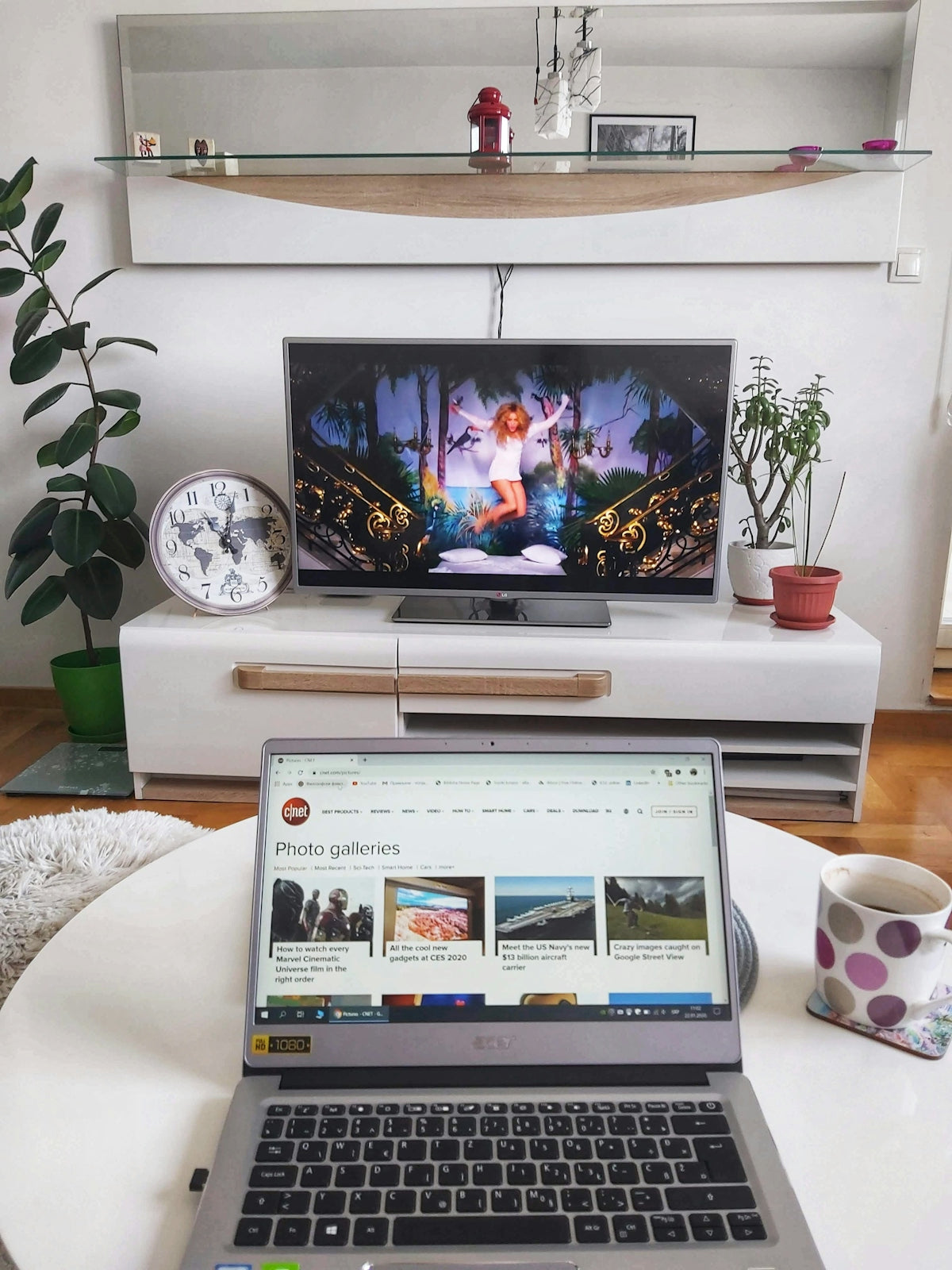 black flat screen tv on white wooden tv rack